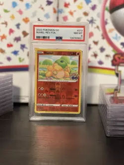 2022 POKEMON GO DITTO #013 NUMEL-REVERSE FOIL PSA 8 - Image 1