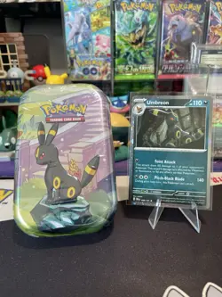 Prismatic Evolutions Umbreon Mini Tin And Promo Card - Image 1