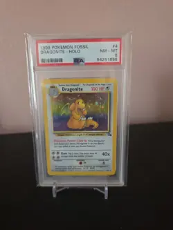Pokemon TCG Dragonite Fossil Holo Unlimited Rare Card 4/62 Graded PSA 8 - Image 1