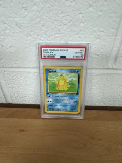 PSA 10 GEM MINT Psyduck 65/82 Team Rocket 1ST EDITION Pokemon Card - Image 1