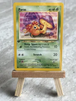 Pokemon TCG Paras 47/64 1st Edition Neo Revelations (English) - NM - Image 1