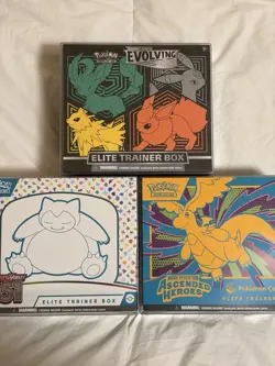 Pokemon TCG Lot Of 3 Sealed ETBs w Plastic Display Cases - Image 1