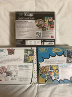 Pokemon TCG Lot Of 3 Sealed ETBs w Plastic Display Cases - Image 2