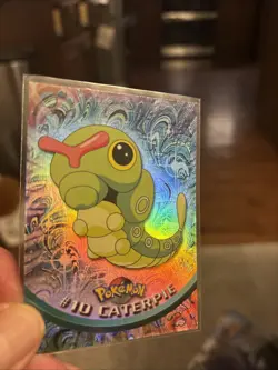 1999 Topps #10 Caterpie Rainbow Foil TV Pokemon Animation Series 1 Blue Logo NM - Image 1