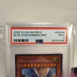 2025 Yu-Gi-Oh! Blue-Eyes Shining Dragon #EN096 RP02 Secret Rare PSA 9 - Image 2