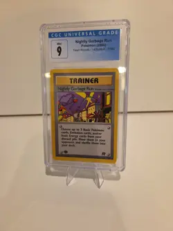 CGC Mint 9 Pokemon 2000 Team Rocket 1st Edition Nightly Garbage Run Trainer #77 - Image 1