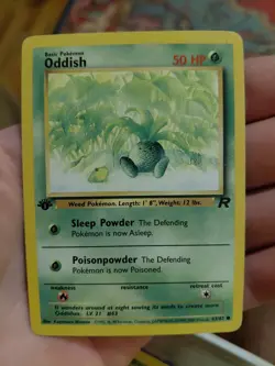 1st Edition Oddish Team Rocket Pokemon TCG - Image 1