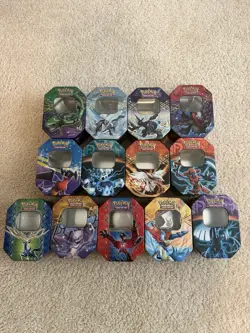 13 Empty Pokemon Tins From Various Sets - Image 1