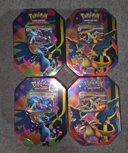 Pokemon TCG Mega Charizard EX Tins Set of 4 (X & Y) FACTORY SEALED - Image 1
