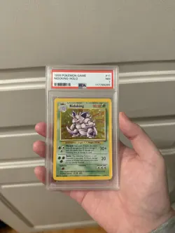 1999 Pokemon TCG Unlimited Base Set Nidoking 11/102 Holo Rare PSA 7 NM - Image 1