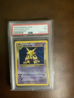 1999 Pokemon Game Alakazam Holo Shadowless #1 PSA-7 - Image 1