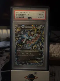 The product is a 2014 Pokemon XY Flashfire M Charizard EX 69/106 Holo Rare Card - Image 1