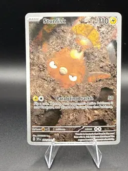 Stunfisk Illustration Rare Holo Card ( Pokemon SV08: Surging Sparks #202/191 ) - Image 1