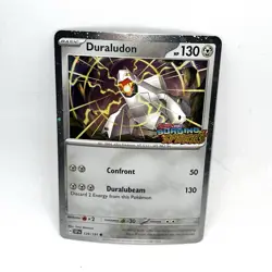 Duraludon 129/191 Surging Sparks Stamped Promo Cosmos Holo Pokemon TCG - Image 1