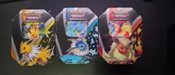 Pokemon TCG: Eevee Evolutions Tin (Set Of 3) Jolteon/Vaporeon/Flareon Sealed - Image 1