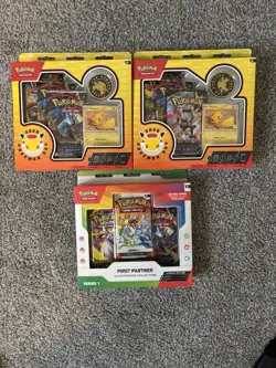 SEALED POKEMON LOT- (1) FIRST PARTNER ILLUSTRATION COLLECTION (2) POKEMON DAY - Image 1