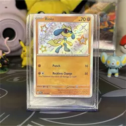 Pokemon Riolu 173/091 SV: Paldean Fates Shiny Rare Holo Basic Card - Image 1
