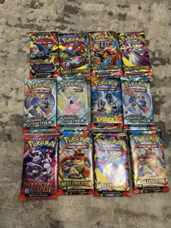 12 Assorted Pokemon TCG Booster Packs Factory Sealed - Image 1