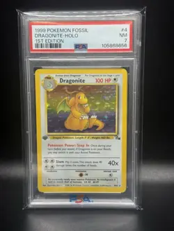 1999 POKEMON FOSSIL 1ST ED #4 DRAGONITE-HOLO PSA 7 - Image 1
