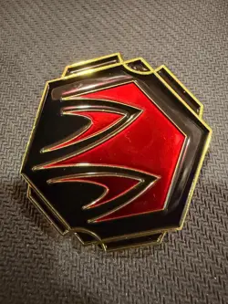 Lorcana TCG Whispers in the Well League Promo Disney Pin: Ruby Ink Symbol - Image 1