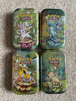 Pokemon TCG Prismatic Evolutions Mini Tins X4 Factory Sealed - Image 1