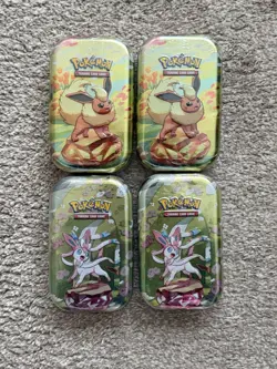 Pokemon TCG Prismatic Evolutions Mini Tins X4 - Factory Sealed Sylveon & Flareon - Image 1
