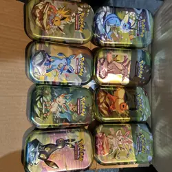 Pokemon TCG Set of 8 Empty Mini Tins Prismatic Evolutions (Tin, Coin, Art Card) - Image 1