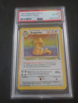 1999 Pokemon Fossil Dragonite 4/62 Holo PSA 8 - Image 1
