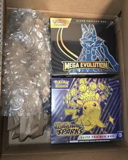 Pokemon Surging Sparks And Mega Evolutions ETB - Image 1