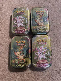 Pokemon TCG: Prismatic Evolutions Mini Tins x 4 – Sealed - Image 1