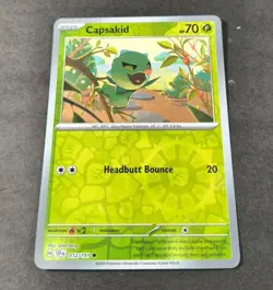Pokemon Surging Sparks Capsakid Reverse Holo Common Card 012/191 NM - Image 1