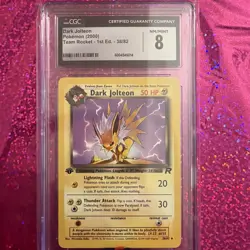2000 POKEMON TEAM ROCKET #38/82 DARK JOLTEON CGC 8 - Image 1