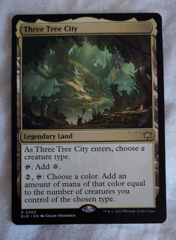 Three Tree City – Bloomburrow BLB – NM Rare Land MTG - Image 1
