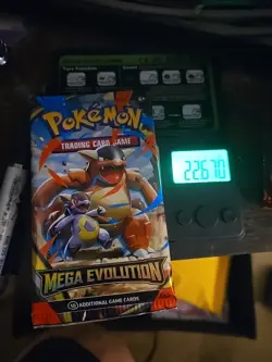 VERY HEAVY Pokemon TCG Mega Evolution Booster Pack In Hand MINT - Image 1