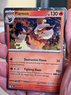 POKEMON FLAREON 013/131 RARE COSMOS HOLOFOIL SWIRL PRISMATIC EVOLUTIONS NM CARD - Image 1
