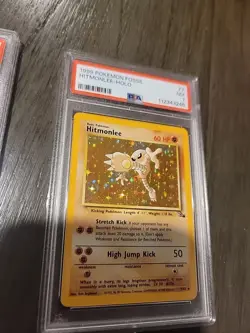 1999 Pokemon Fossil Hitmonlee Holo PSA 7 - Image 2