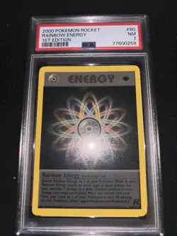 2000 Pokemon Team Rocket 1st Edition Rainbow Energy #80 PSA 7 - Image 1