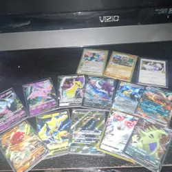 Pokemon Trading Card Game Mixed Card Lot with Tin, Holo, Sylveon, Tyranitar - Image 1