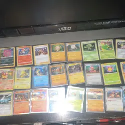 Pokemon Trading Card Game Mixed Card Lot with Tin, Holo, Sylveon, Tyranitar - Image 3