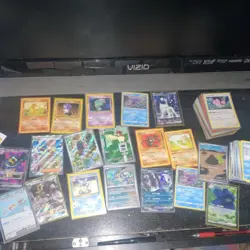 Pokemon Trading Card Game Mixed Card Lot with Tin, Holo, Sylveon, Tyranitar - Image 4