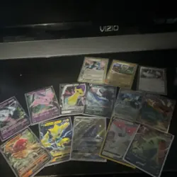 Pokemon Trading Card Game Mixed Card Lot with Tin, Holo, Sylveon, Tyranitar - Image 5