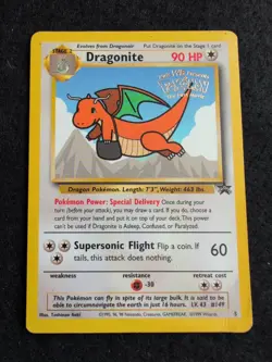 1999 Pokemon TCG Dragonite WB Stamped Movie Promo #5 WOTC Black Star - crease - Image 1