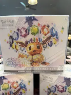 Pokemon Prismatic Evolutions Elite Trainer Box Eevee small tear - Image 1