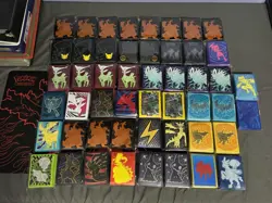 x50 Lot of Pokemon TCG ETB Card Sleeves Charizard 25th Mimikyu NEW - Image 1