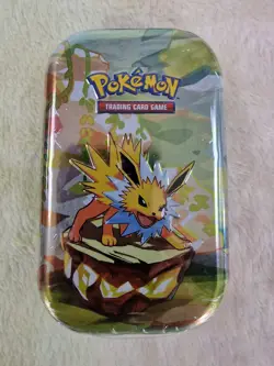 Pokemon Scarlet & Violet - Prismatic Evolutions Mini Tin - DENTED BUT SEALED - Image 1