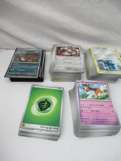 Bundle of Pokemon Cards in Collectable Tin VGC S&V Era - Image 3