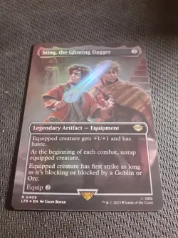 1x FOIL BORDERLESS STING, THE GLINTING DAGGER - Lord of the Rings - MTG - Magic - Image 1
