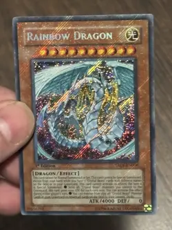 Yugioh Rainbow Dragon TAEV-EN006 Secret Rare 1st Edition LP Holo Bleed - Image 1