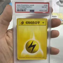 1999 Pokemon Game 1st Edition Shadowless 100 Lightning Energy, PSA 8 - Image 1