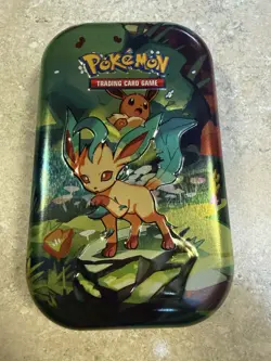 Pokemon TCG Scarlet & Violet Prismatic Evolutions Mini Tin And New Energy Cards - Image 1